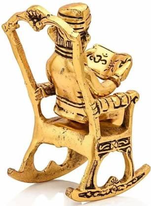 Trendhubs Golden Lord Ganesha Statue Sitting On A Rocking Chair And Reading Ramayan Showpiece