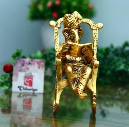 Trendhubs Golden Lord Ganesha Statue Sitting On A Rocking Chair And Reading Ramayan Showpiece