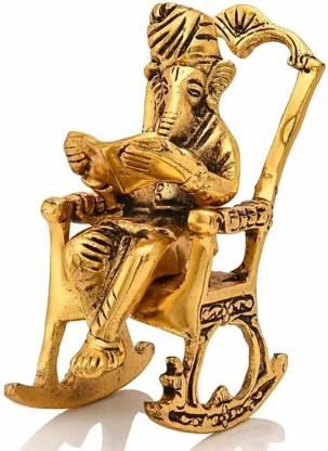 Trendhubs Golden Lord Ganesha Statue Sitting On A Rocking Chair And Reading Ramayan Showpiece