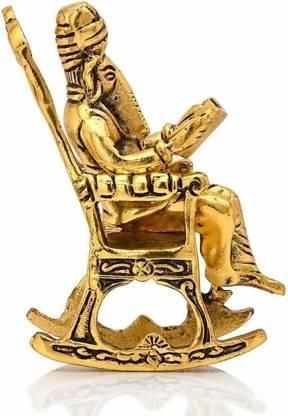 Trendhubs Golden Lord Ganesha Statue Sitting On A Rocking Chair And Reading Ramayan Showpiece
